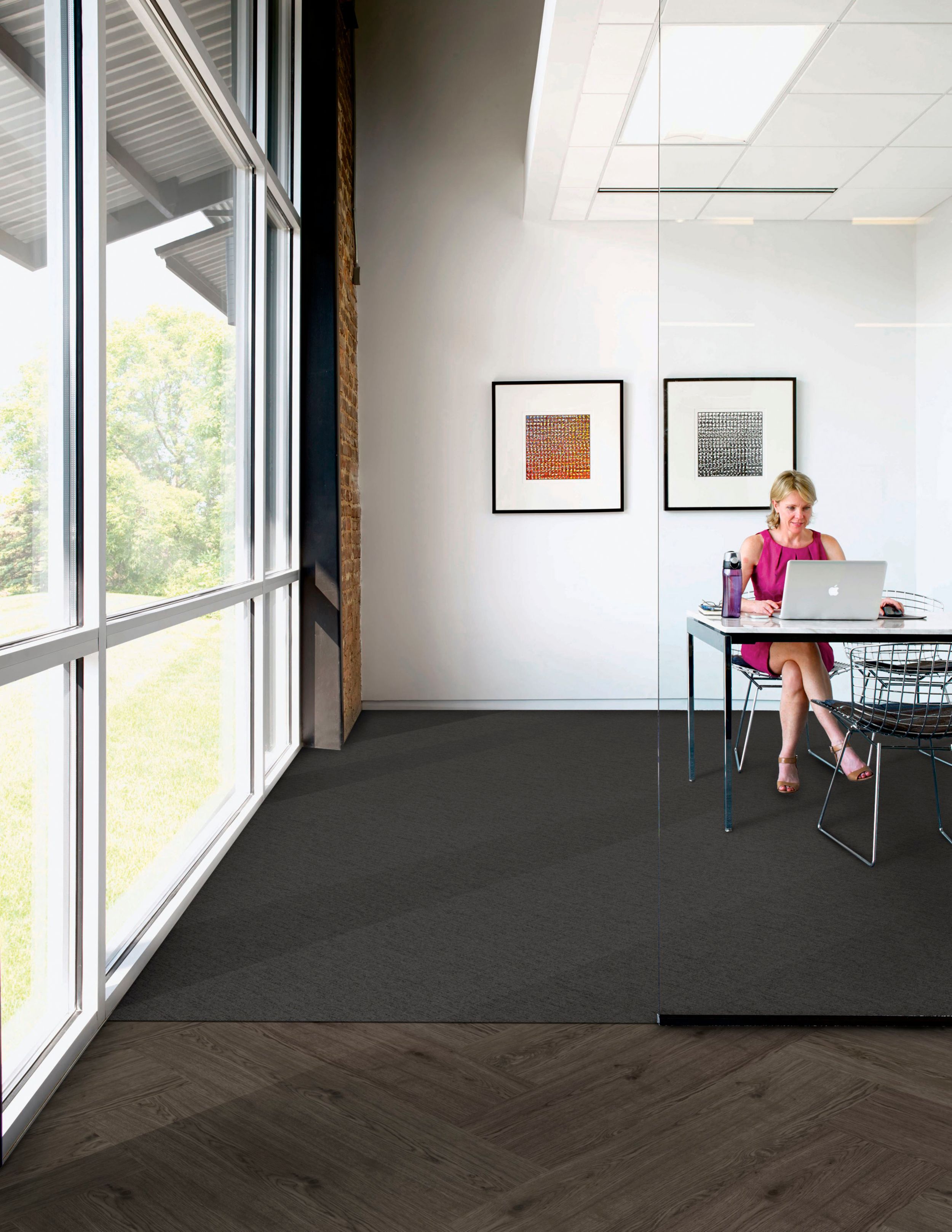 Interface UR303 carpet tile in private office with woman at computer and Natural Woodgrains LVT in outer office image number 5